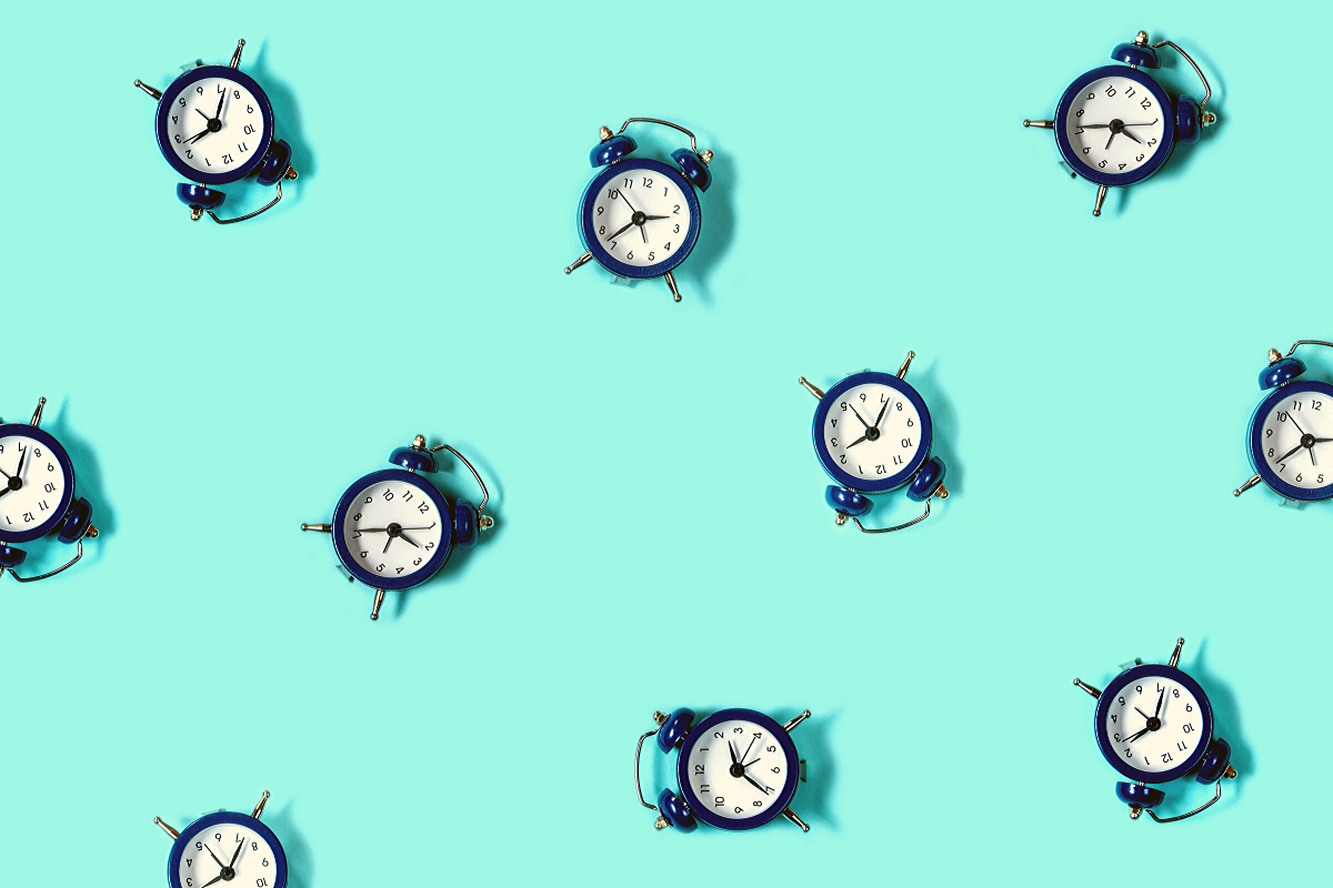 Blue clocks on a light blue background.